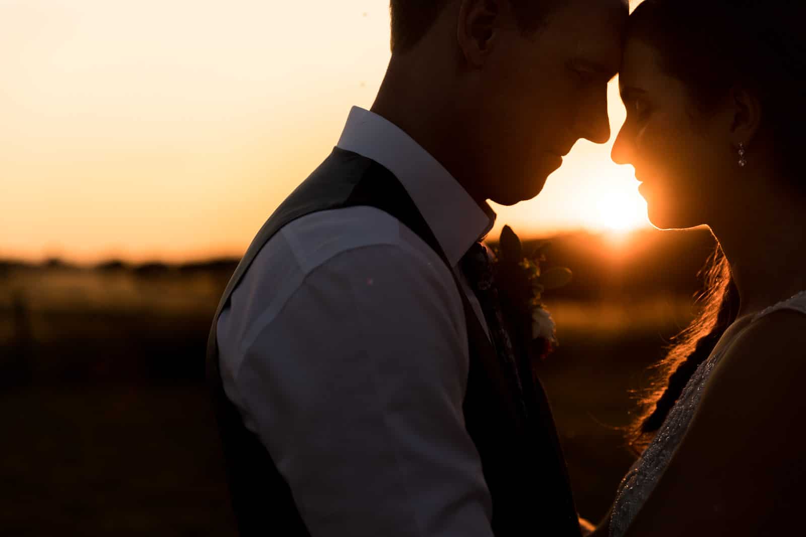 Golden hour photo of the wedding couple embracing in northamptonshire