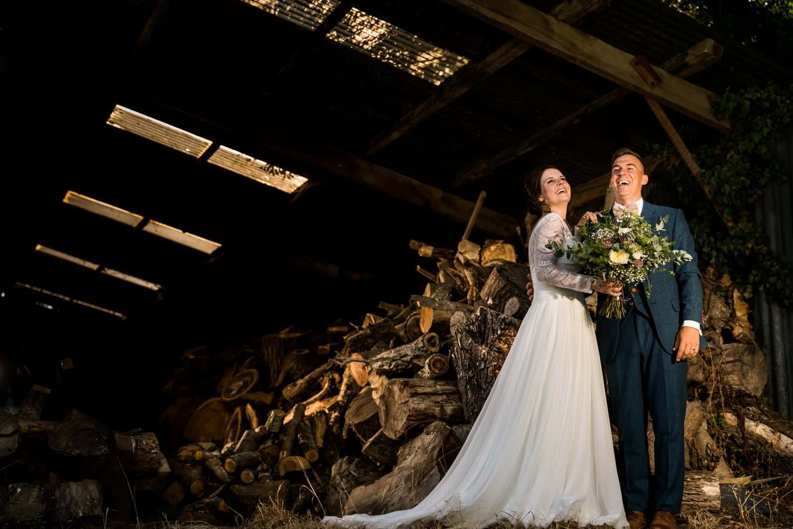 Bassmead wedding photography of couple standing in the wood store